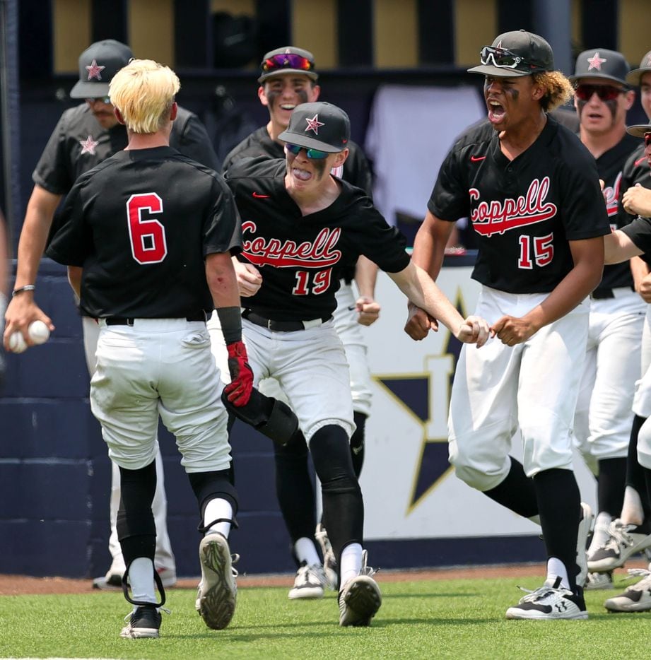 Coppell outfielder Carter Fields (6) celebrates with his teammates after scoring a run...