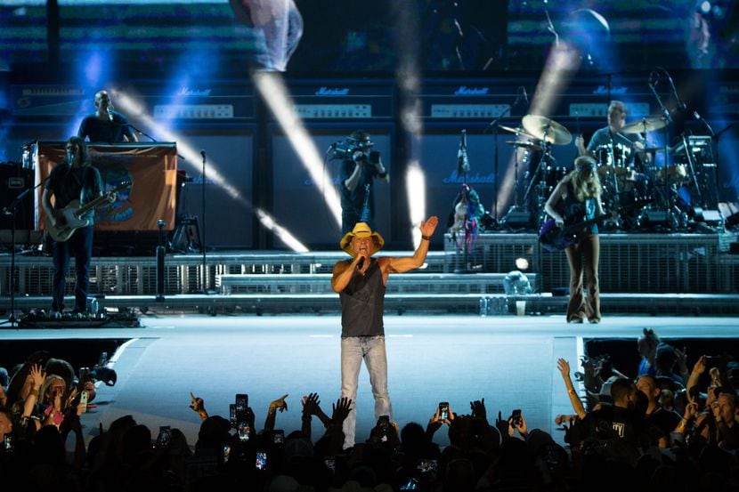 Kenny Chesney performs on stage during the his Spread the Love Tour concert at AT&T Stadium...