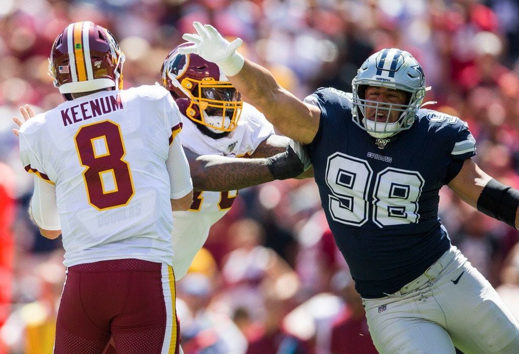 Dallas Cowboys defensive tackle Tyrone Crawford (98) threatens Washington Redskins quarterback Case Keenum (8) during the first quarter of an NFL game between the Dallas Cowboys and the Washington Redskins on Sunday, September 15, 2019 at FedExField in Landover, Maryland.
