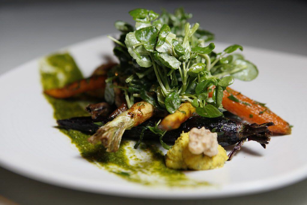 A dish of roasted rainbow baby carrots, shropshire blue mousse, candied walnuts, honey dijon...