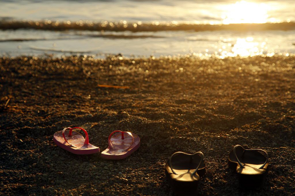 Swimmers leave their sandals on the shores of Joe Pool Lake July 30, 2011 in Dallas County. 