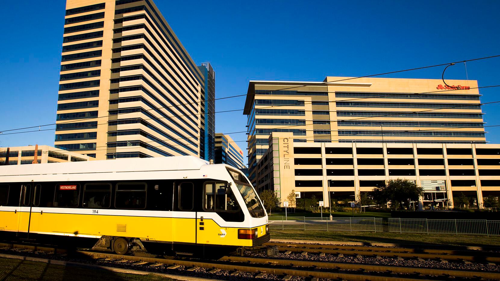The DART Red Line train departs the Bush Turnpike Station at the CityLine development in...