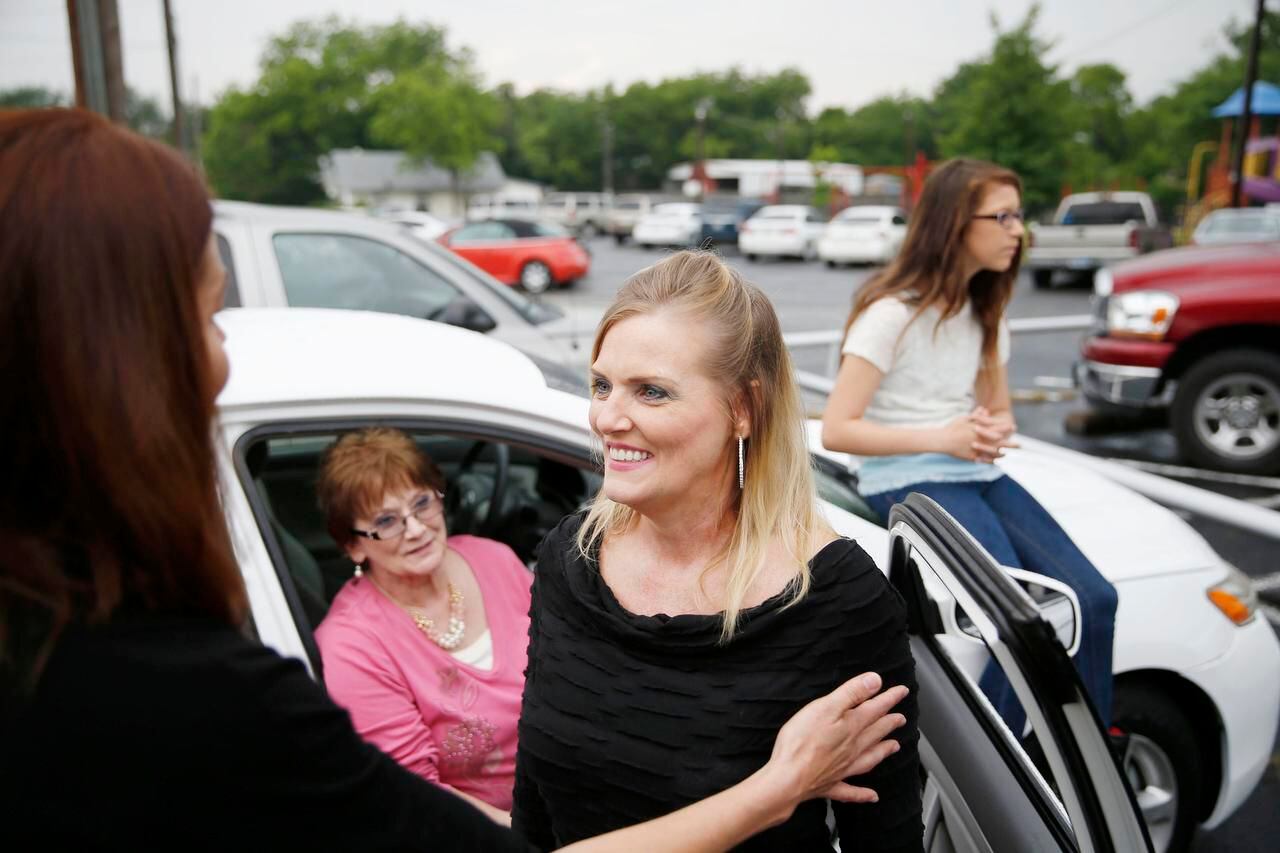 Jennifer Wilson speaks to Bobbie Johnson (left) after receiving one of the vehicles Johnson...