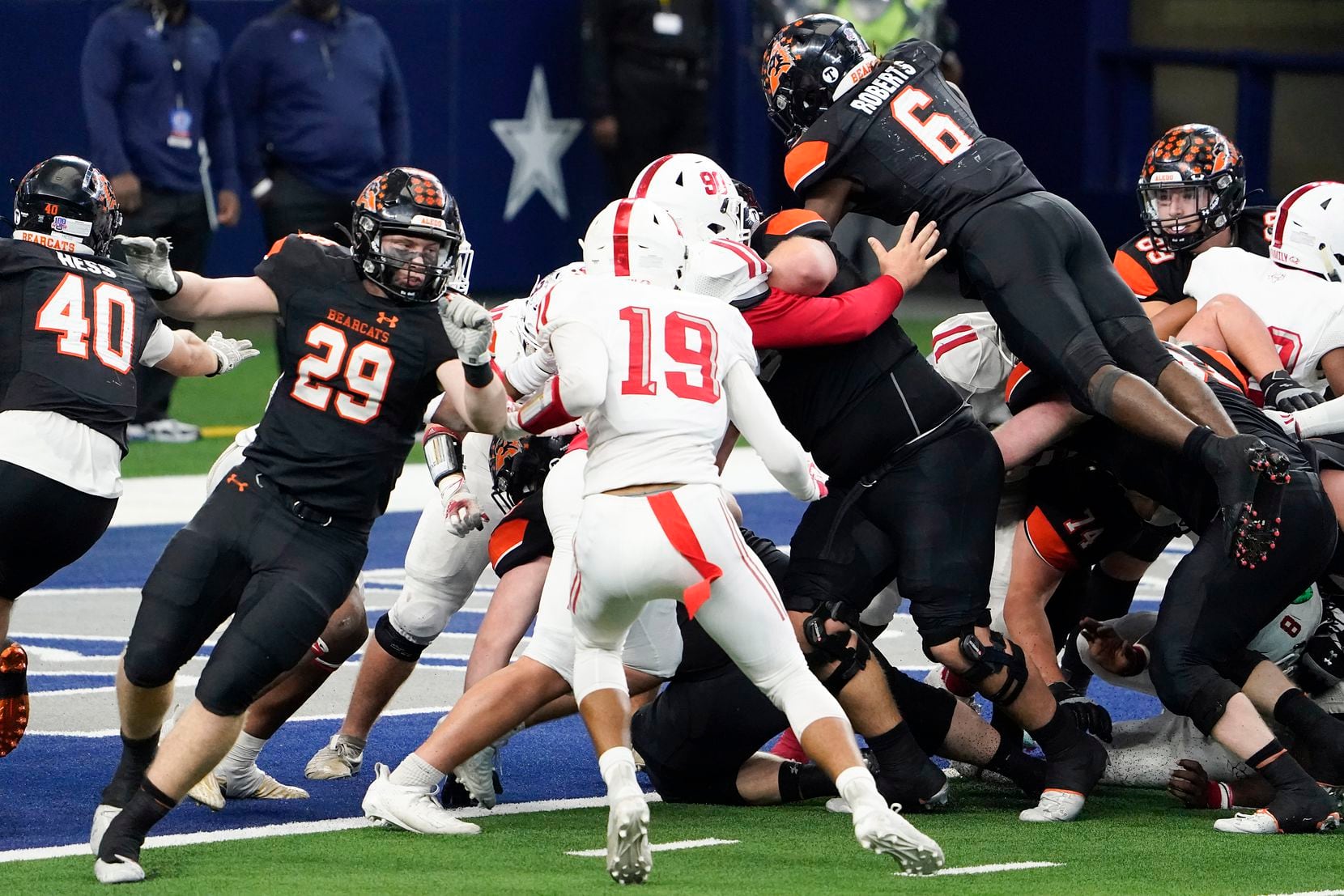 Aledo running back DeMarco Roberts (6) dives over the pile for a touchdown during the second half of a 56-21 victory over Crosby to win the Class 5A Division II state football championship game at AT&T Stadium on Friday, Jan. 15, 2021, in Arlington. The victory gave the Bearcats the 10th state championship in school history. (Smiley N. Pool/The Dallas Morning News)