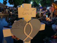 A cross was added Friday with the name of Joe García, the husband of Irma García, the Robb...