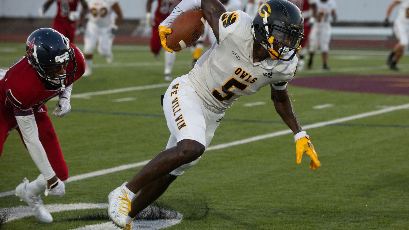 Garland High School wide receiver Jordan Hudson (5) powers through the defense during their season-opening game against Justin F. Kimball High School at Sprague Stadium in Dallas, TX on August 27, 2021.   (Shelby Tauber/Special Contributor)