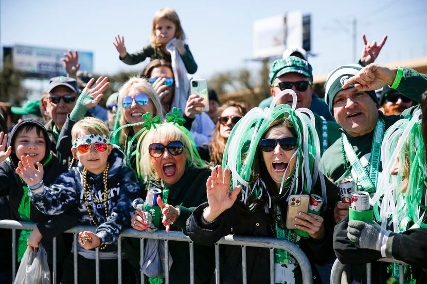 People cheer at Dallas’ annual St. Patrick’s Day parade on Saturday.