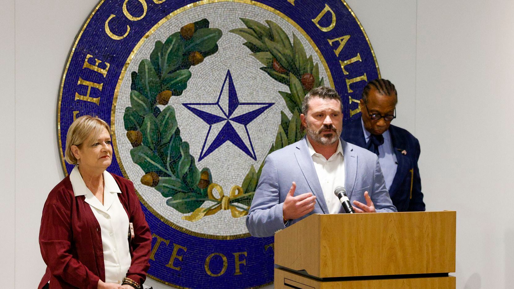Dallas County Commissioner J.J. Koch speaks alongside commissioners Theresa Daniel (left)...