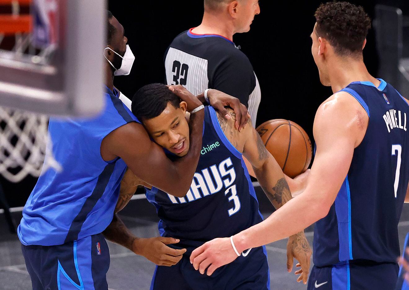 Dallas Mavericks guard Trey Burke (3) is congratulated by teammates after hitting a last second three-pointer to end the first quarter Cleveland Cavaliers at the American Airlines Center in Dallas, Friday, May 7, 2021. (Tom Fox/The Dallas Morning News)