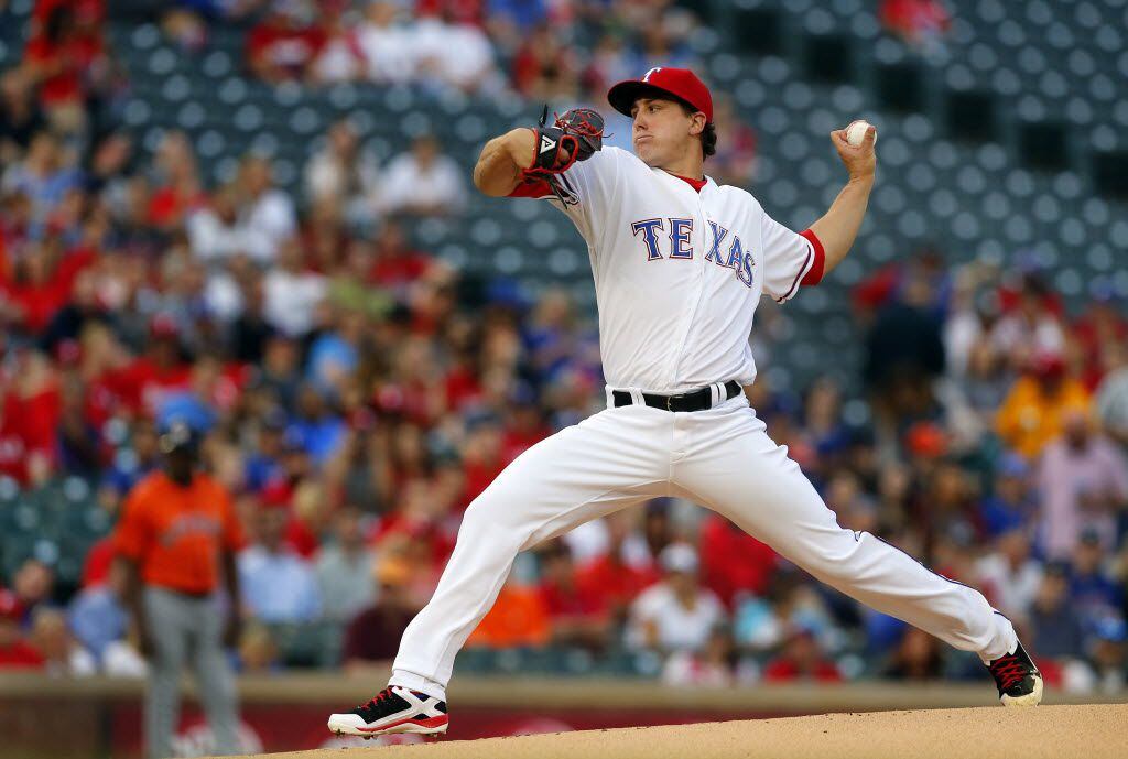 Texas Rangers starting pitcher Derek Holland (45) pitches in the first inning against the...