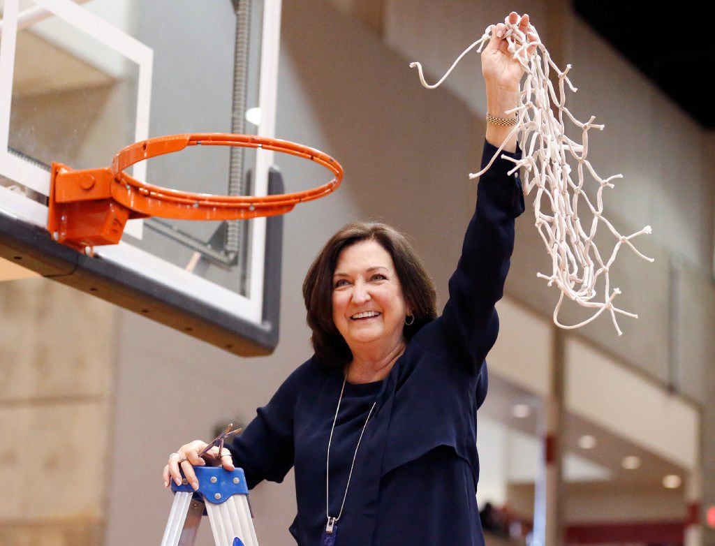 Duncanville girls basketball coach Cathy Self-Morgan celebrates her team's 62-49 win over...