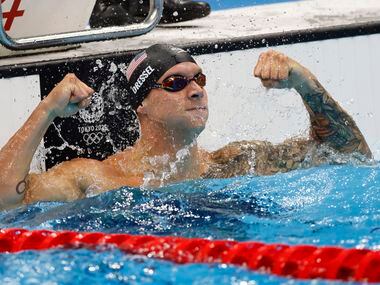 USA’s Caeleb Dressel celebrates after winning the men’s 50 meter freestyle final during the...
