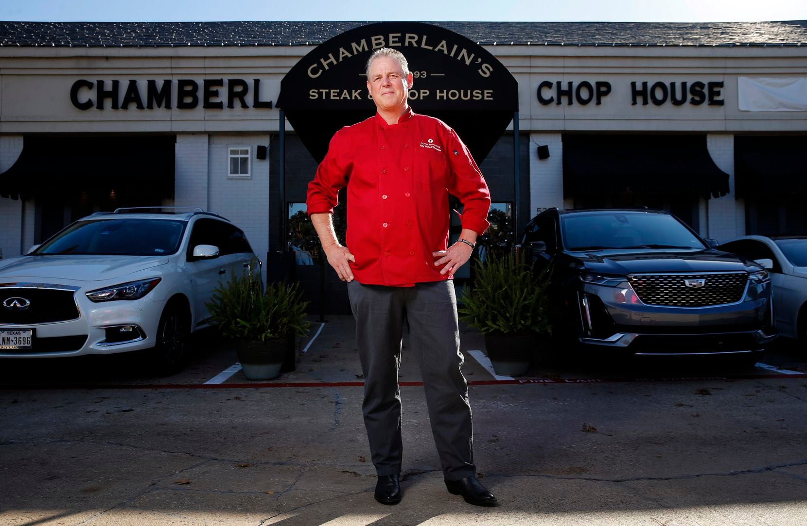 Richard Chamberlain, owner and chef of Chamberlains Steakhouse, poses in front of his Dallas...