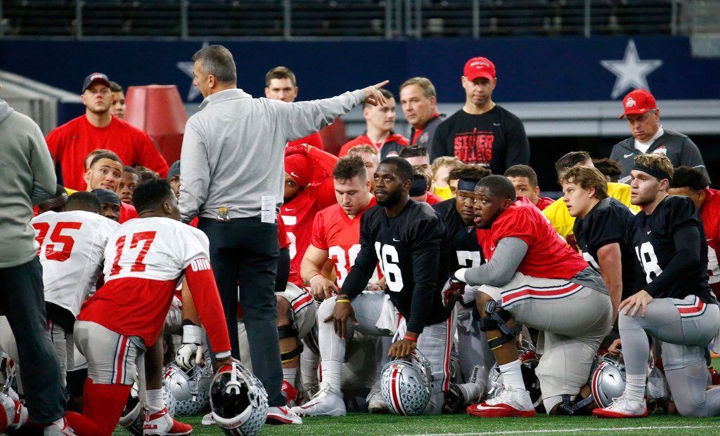 Ohio State's head coach Urban Meyer talks to his team during practice against USC for the...