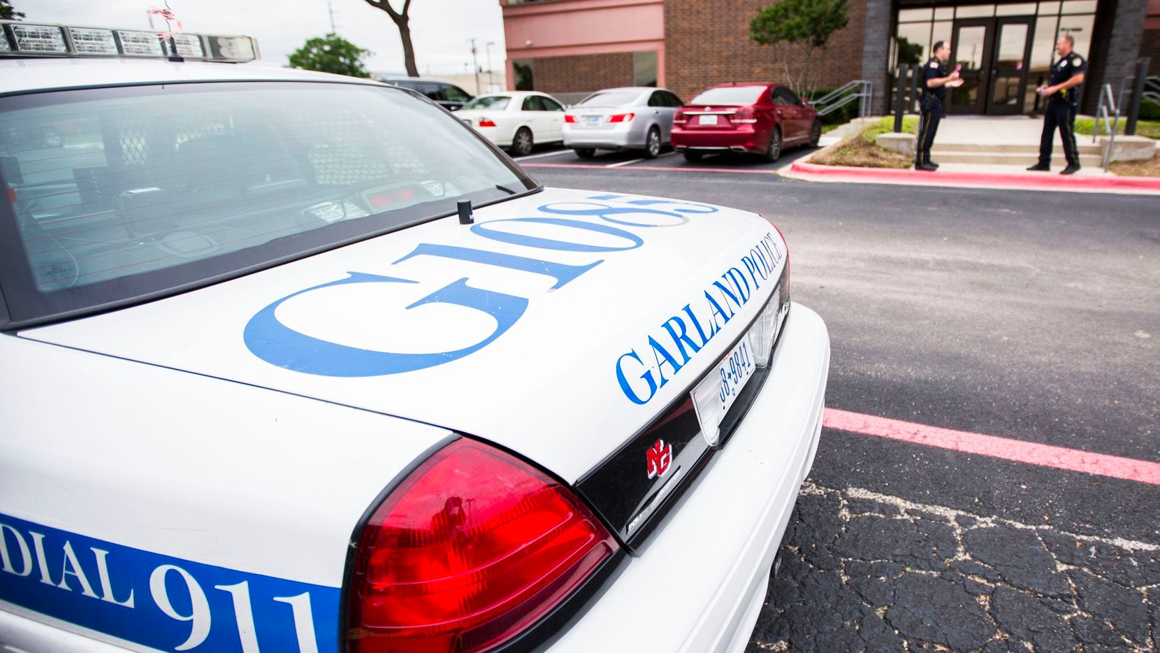 A Garland police car is parked outside a school board meeting in this 2015 file photo.
