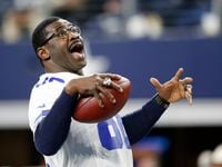 Dallas Cowboys former receiver Michael Irvin (88) plays catch with himself after being introduced before a game against the Philadelphia Eagles at AT&T Stadium in Arlington, Texas on Sunday, November 19, 2017. (Vernon Bryant/The Dallas Morning News)