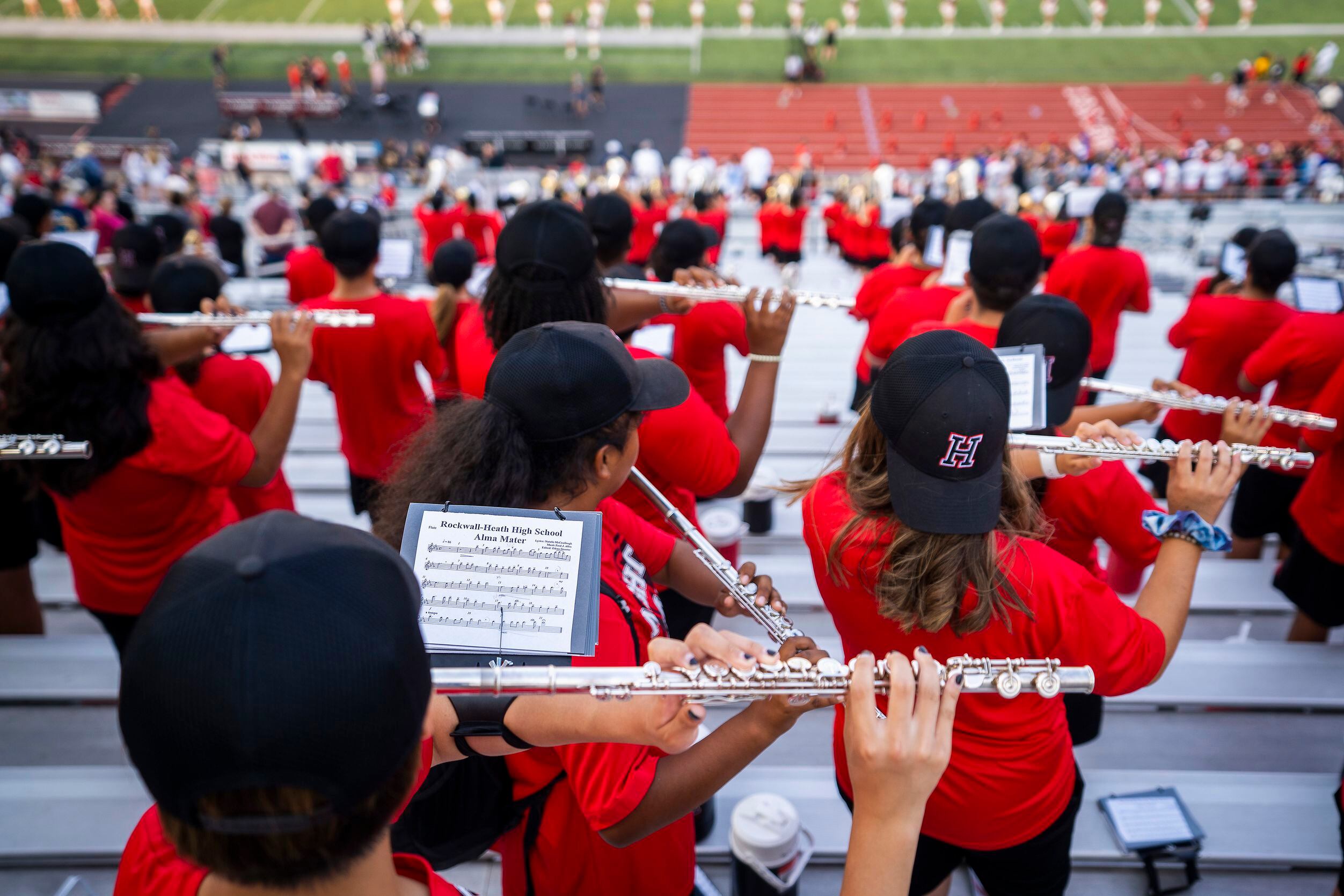 Members of the Rockwall-Heath band play their Alma Mater before a high school football game...