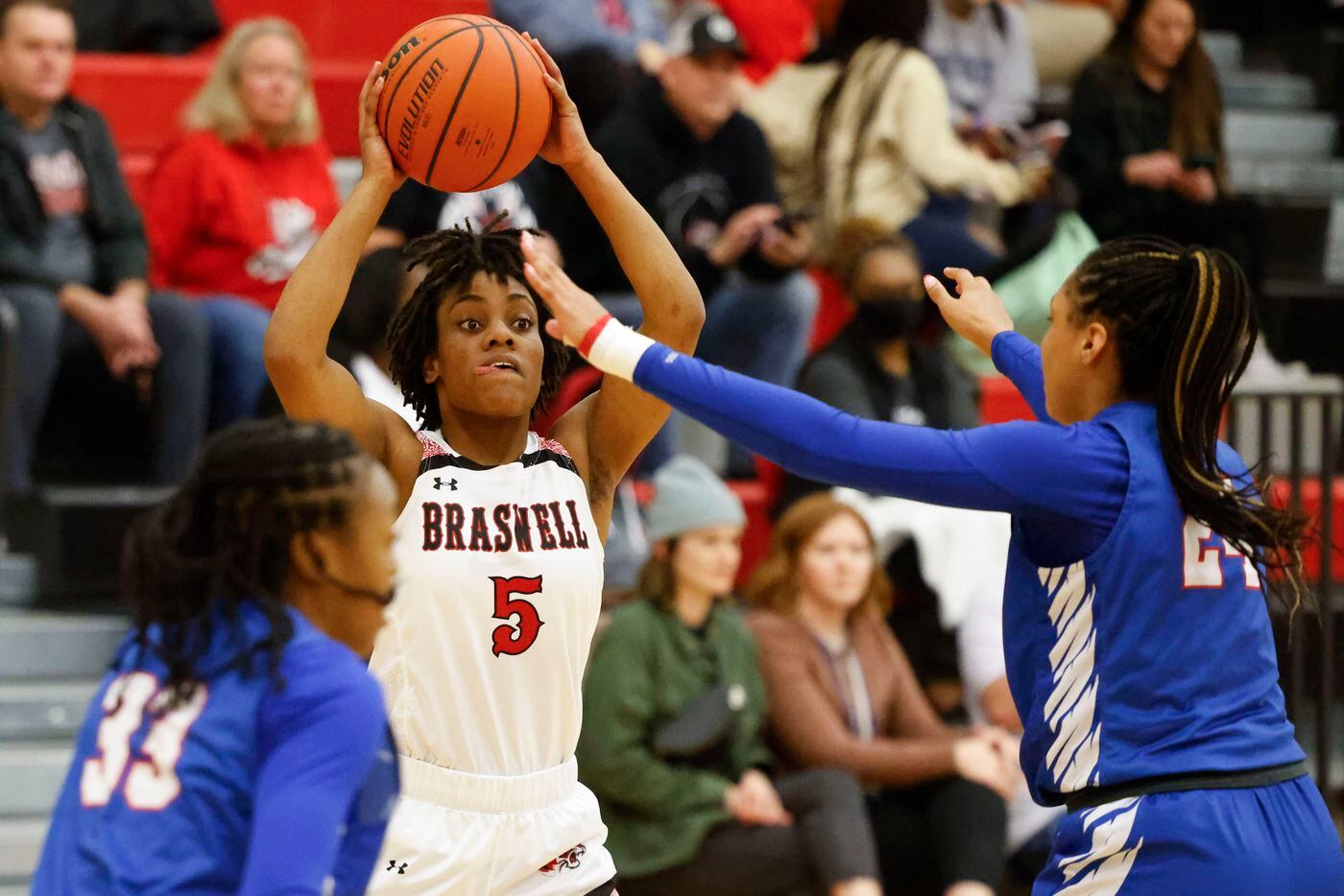 Braswell’s Danae Crosby (5) looks to pass past Allen’s Alexis Cortex, right, and Heaven...