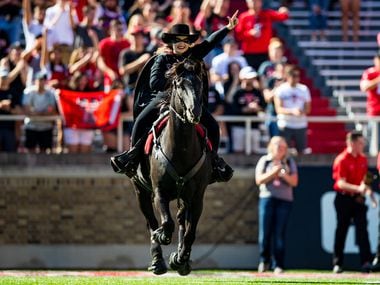 The Masked Rider, mascot of the Texas Tech Red Raiders, leads the team onto the field before the college football game between the Texas Tech Red Raiders and the Oklahoma State Cowboys on October 05, 2019 at Jones AT&T Stadium in Lubbock, Texas.