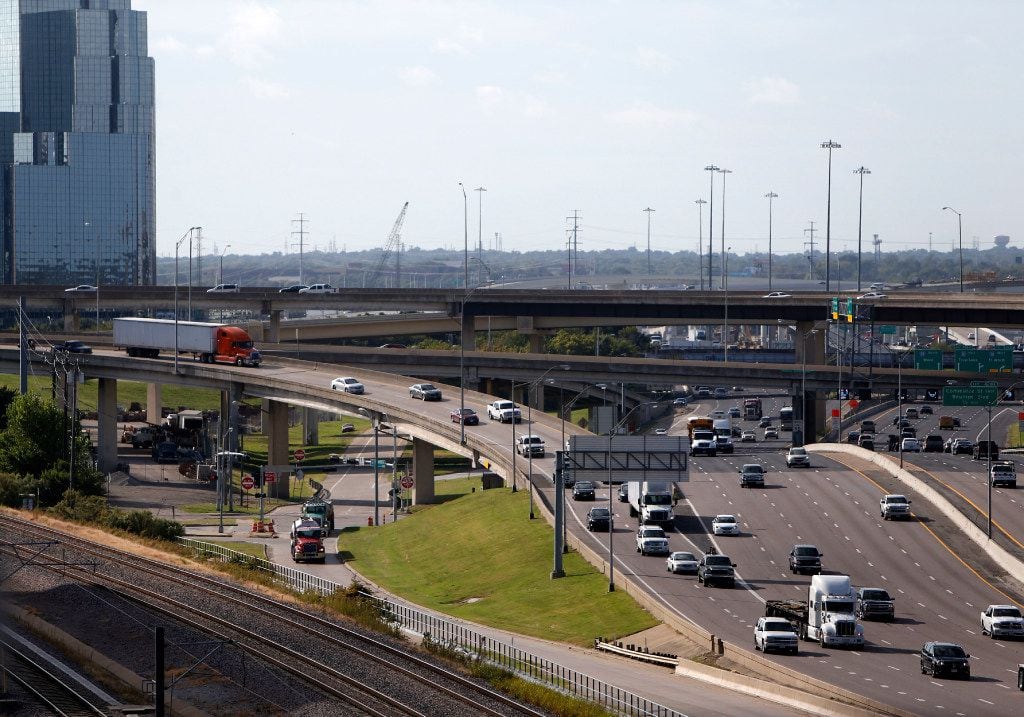 Traffic exits Woodall Rodgers Freeway onto northbound Stemmons (I-35) near downtown Dallas...