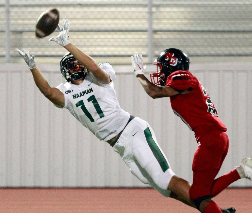 Garland Naaman Forest wide receiver Devean Deal (11) stretches out to catch a long pass during Friday's 42-18 win over North Garland. Deal was one of the area's top receivers on the night, finishing with 148 yards. (John F. Rhodes / Special Contributor)