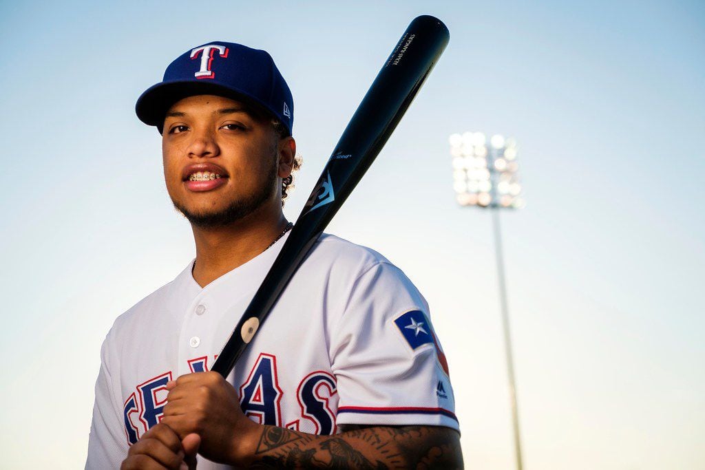 Texas Rangers outfielder Willie Calhoun poses for a photograph during spring training photo...