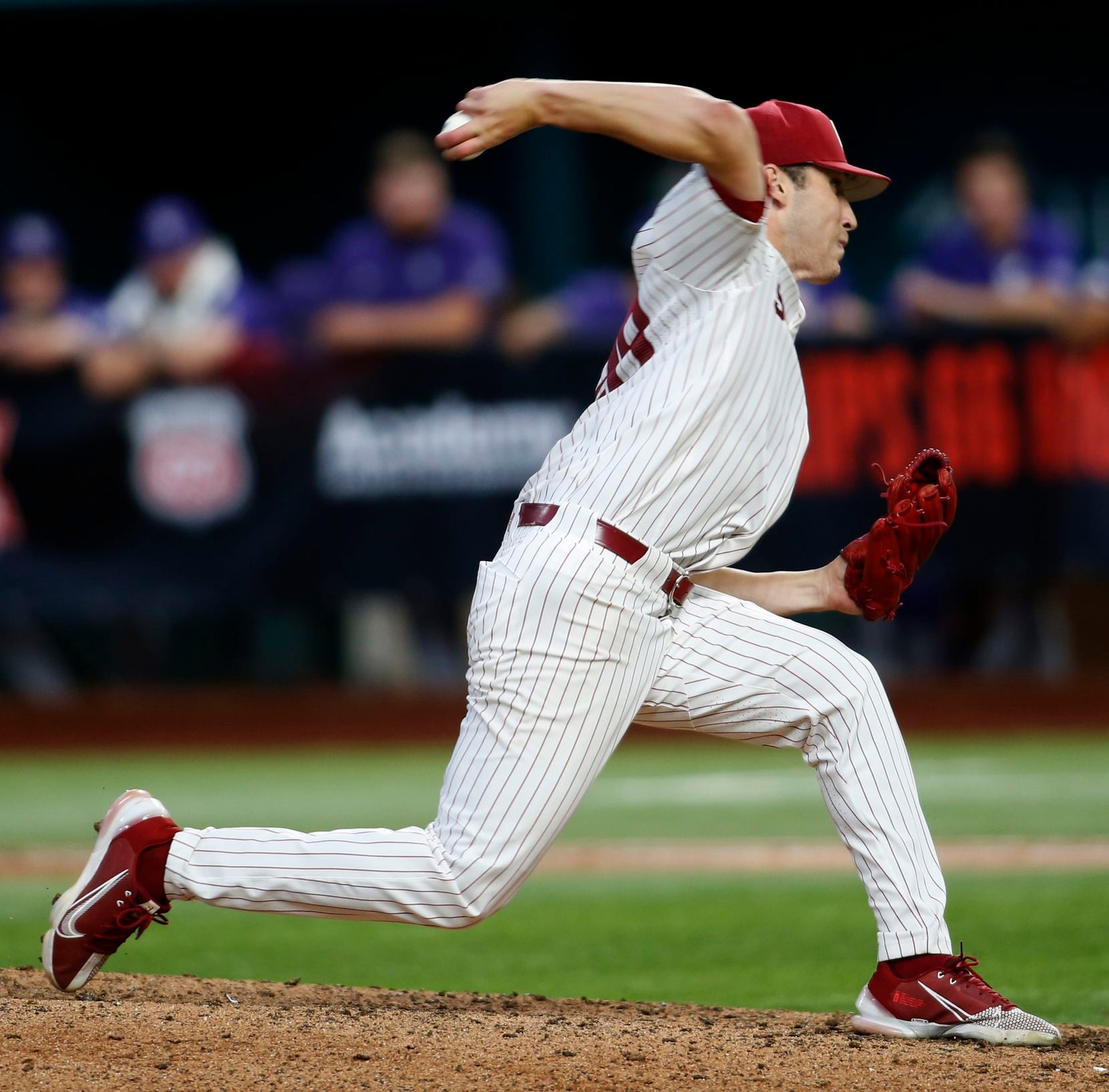 Oklahoma Sooners pitcher David Sandlin (28) delivers a pitch to a Kansas State batter during...