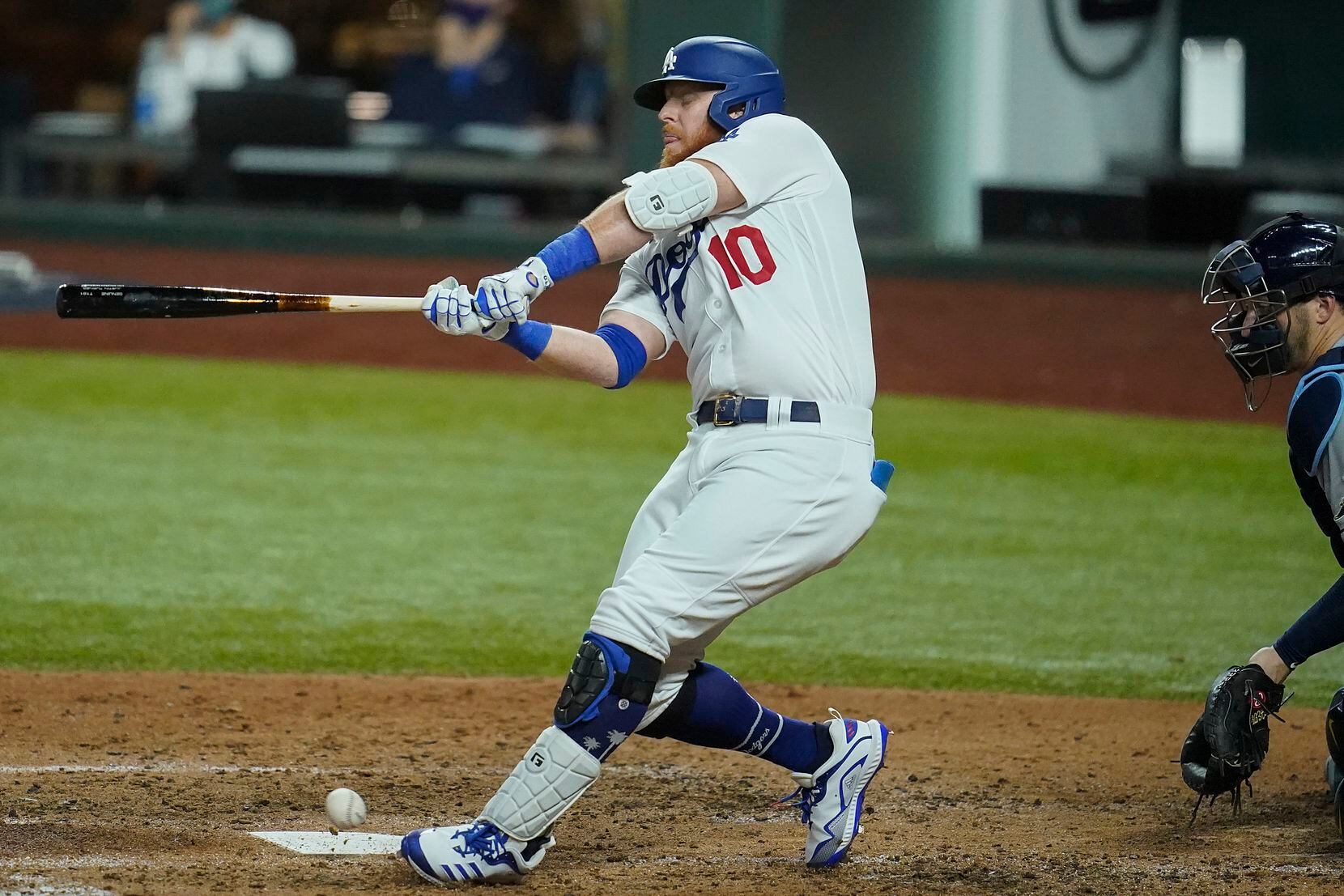 Los Angeles Dodgers third baseman Justin Turner strikes out on a pitch in the dirt against...