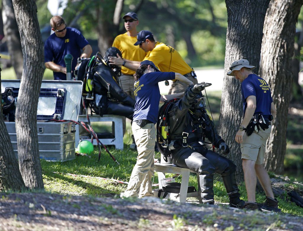  FBI diversÂ got ready to search an area of Turtle Creek for evidence on Wednesday. (Jae S....