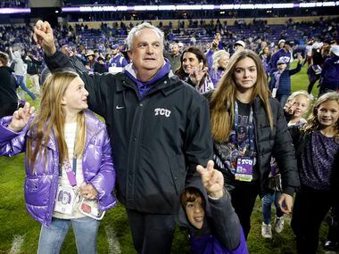 TCU Horned Frogs head coach Sonny Dykes celebrates the team's 62-14 win with family at Amon...