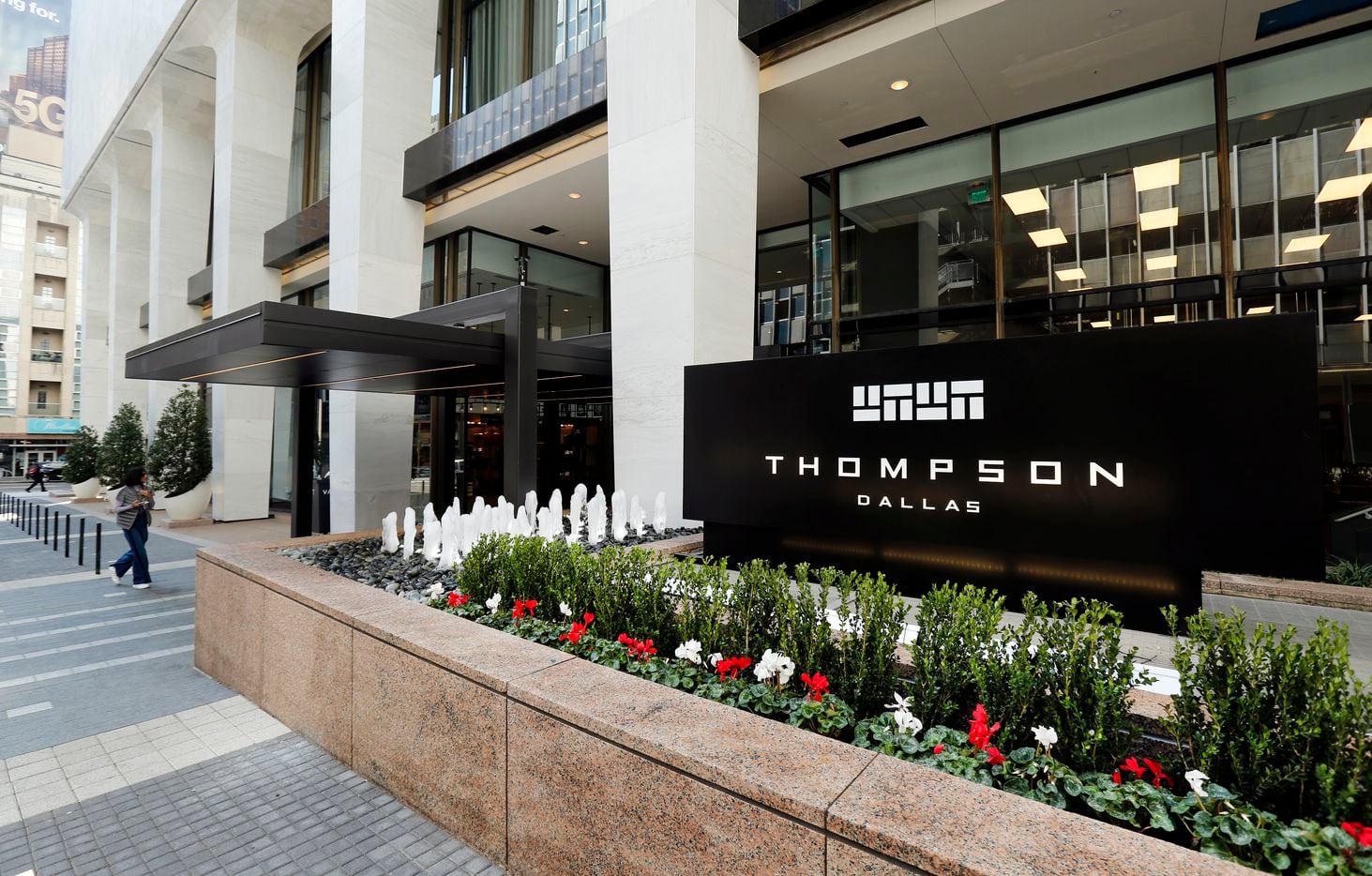 An exterior view of the entry to the 219-room Thompson Dallas luxury hotel that is part of a $460 million redevelopment of  the old First National Bank Tower in downtown Dallas.