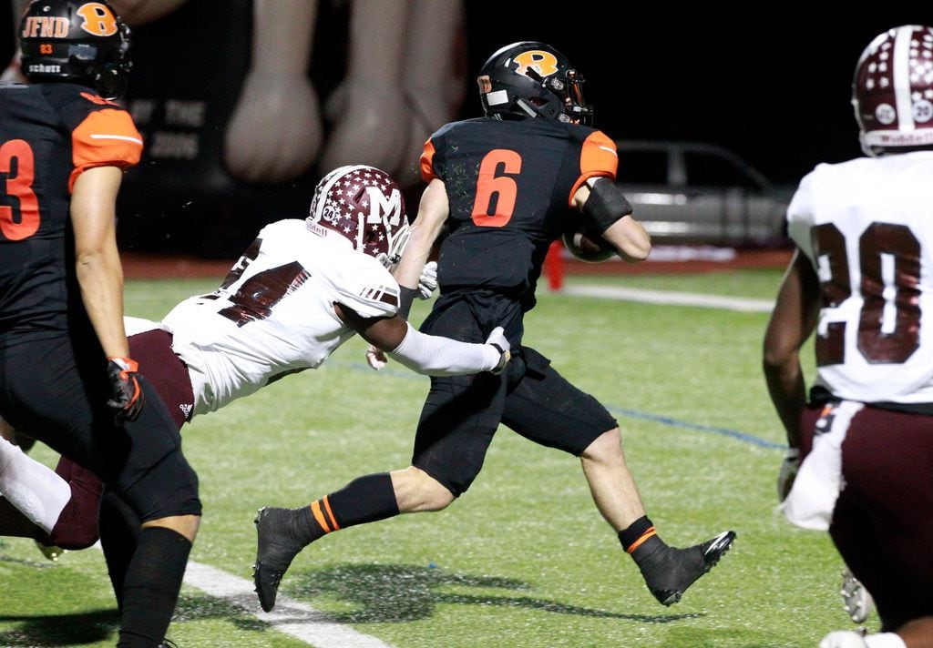 Rockwall RB Zack Henry (6) takes a Mesquite defender with I'm to the end zone for a...