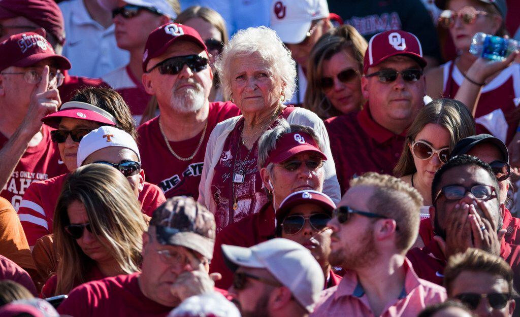 Oklahoma Sooners fan Nancy McCall, 83, watches from the stands during the AT&T Red River...