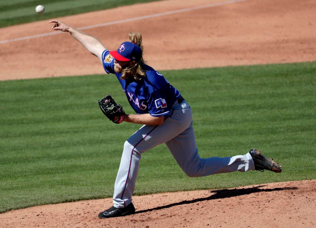 Texas Rangers starting pitcher A.J. Griffin throws against the Seattle Mariners during the third inning of a spring training baseball game, Monday, March 6, 2017, in Peoria, Ariz. (AP Photo/Matt York)