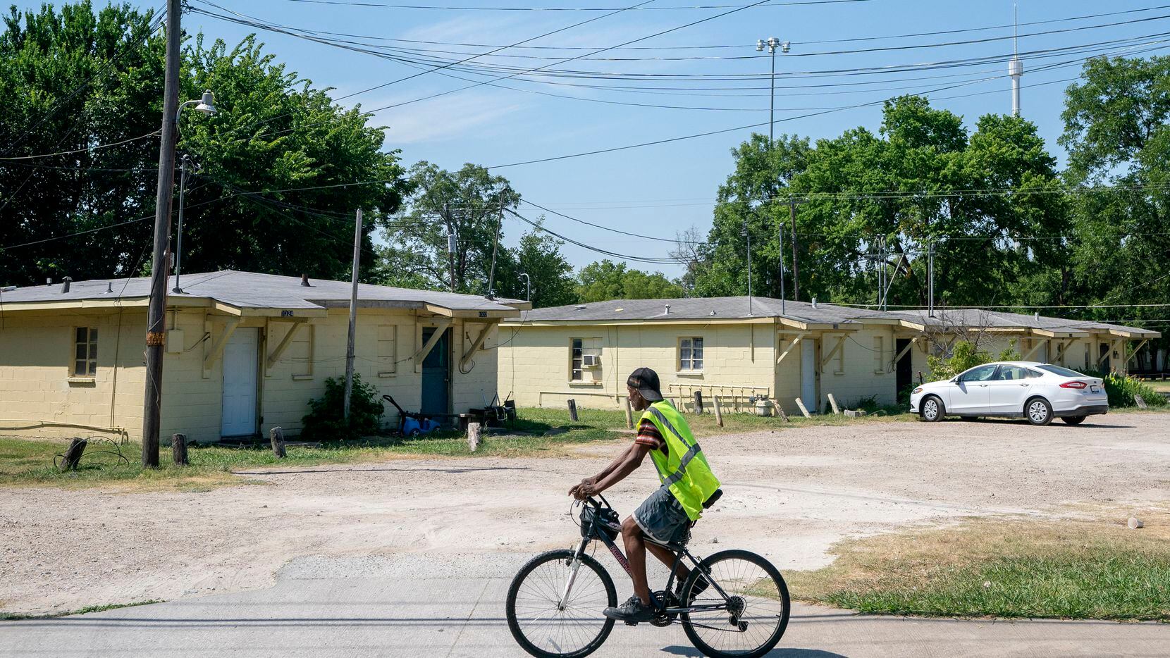 A cyclist rides past an apartment complex on Haskell Avenue Wednesday, June 29, 2022 at in...