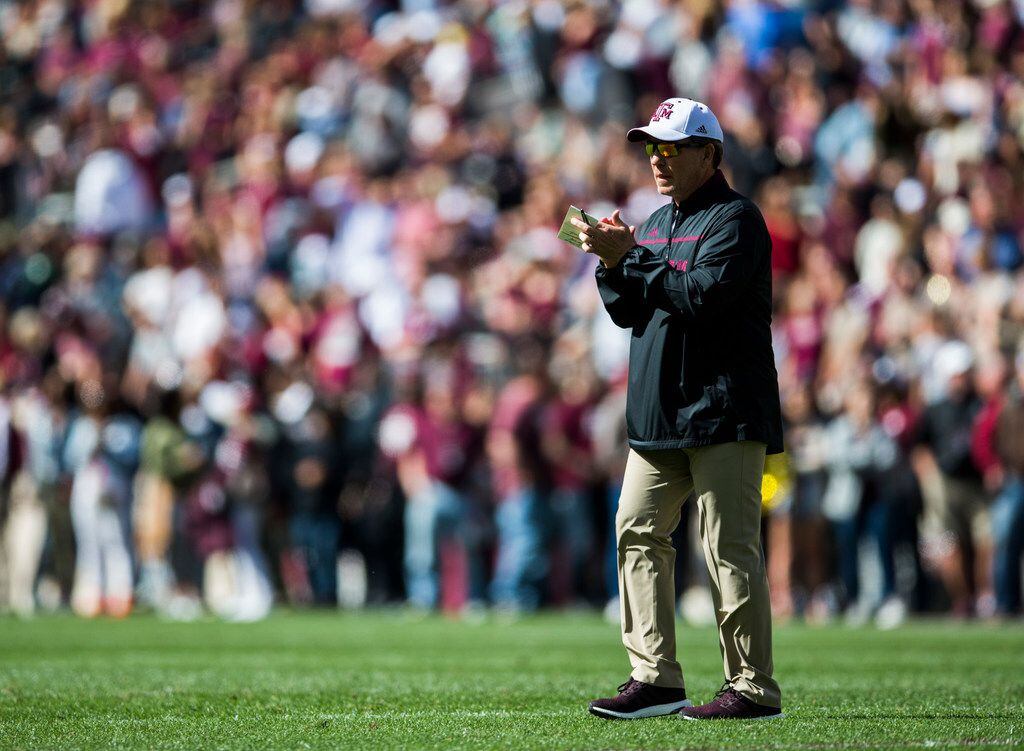 Texas A&M Aggies head coach Jimbo Fisher applauds his team during the first quarter of a...