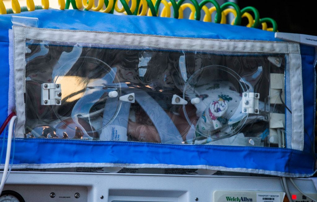 One of ten babies in a Neonatal Intensive Care Unit is transported from a Cook Children's...