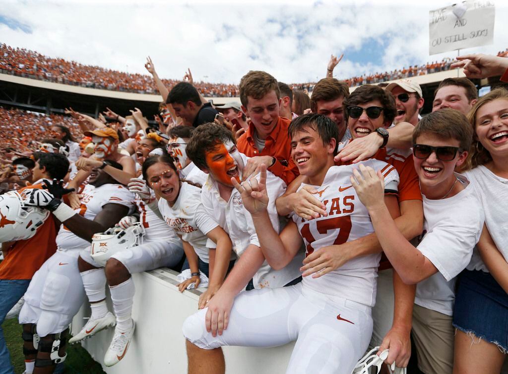Texas Longhorns place kicker Cameron Dicker (17) celebrates with fans after defeating the...
