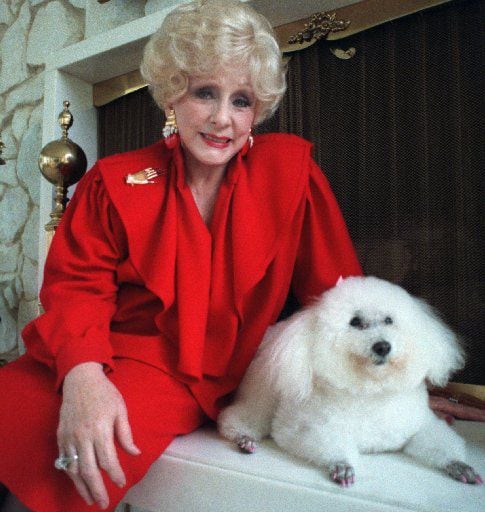Mary Kay Ash poses with her 15-year-old poodle 'Gigi' in her North Dallas home. 