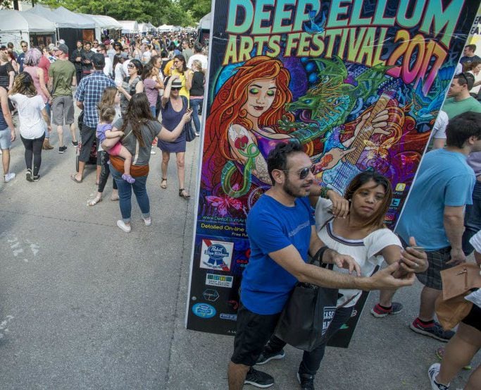 A couple takes a selfie at the Deep Ellum Arts Festival.