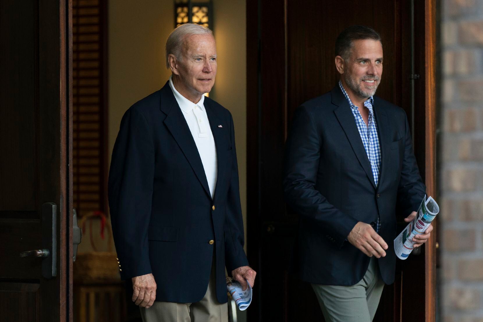 President Joe Biden and his son Hunter Biden leave Holy Spirit Catholic Church in Johns...