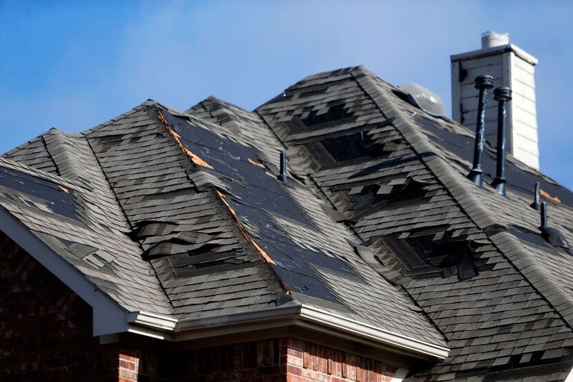 The damaged roof of a home along Avondale Drive in Frisco on Monday, Jan. 16, 2017, after...