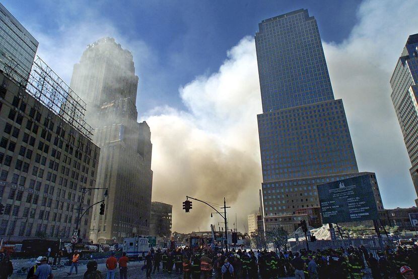 In this file photo taken on Sept. 12, 2001, smoke billows from the scene of the World Trade...
