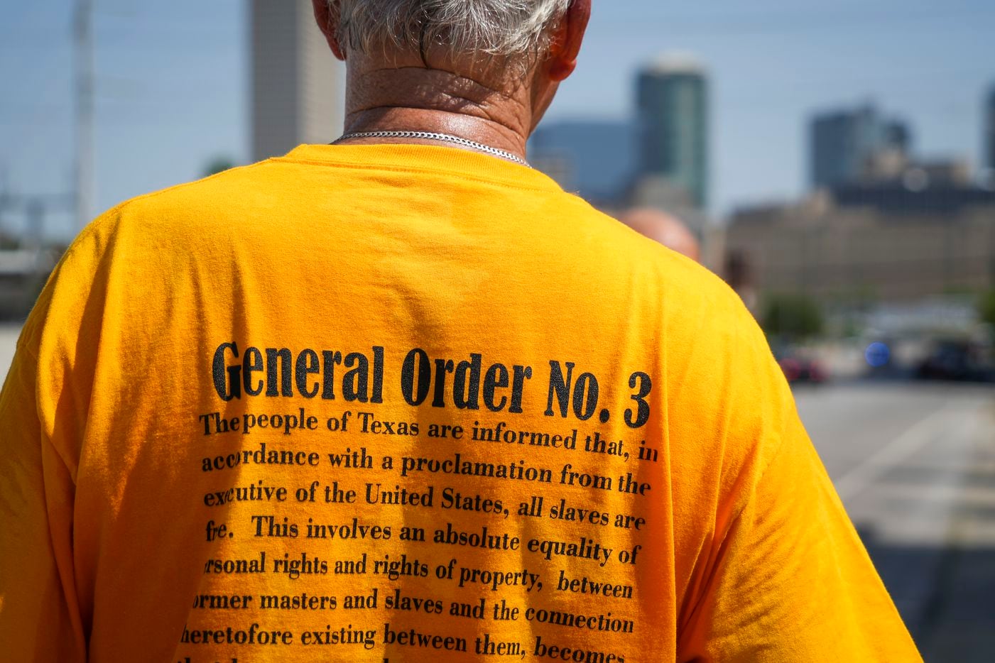 A walker wears a t-shirt bearing General Order No. 3 during the 2022 Opal's Walk for Freedom...