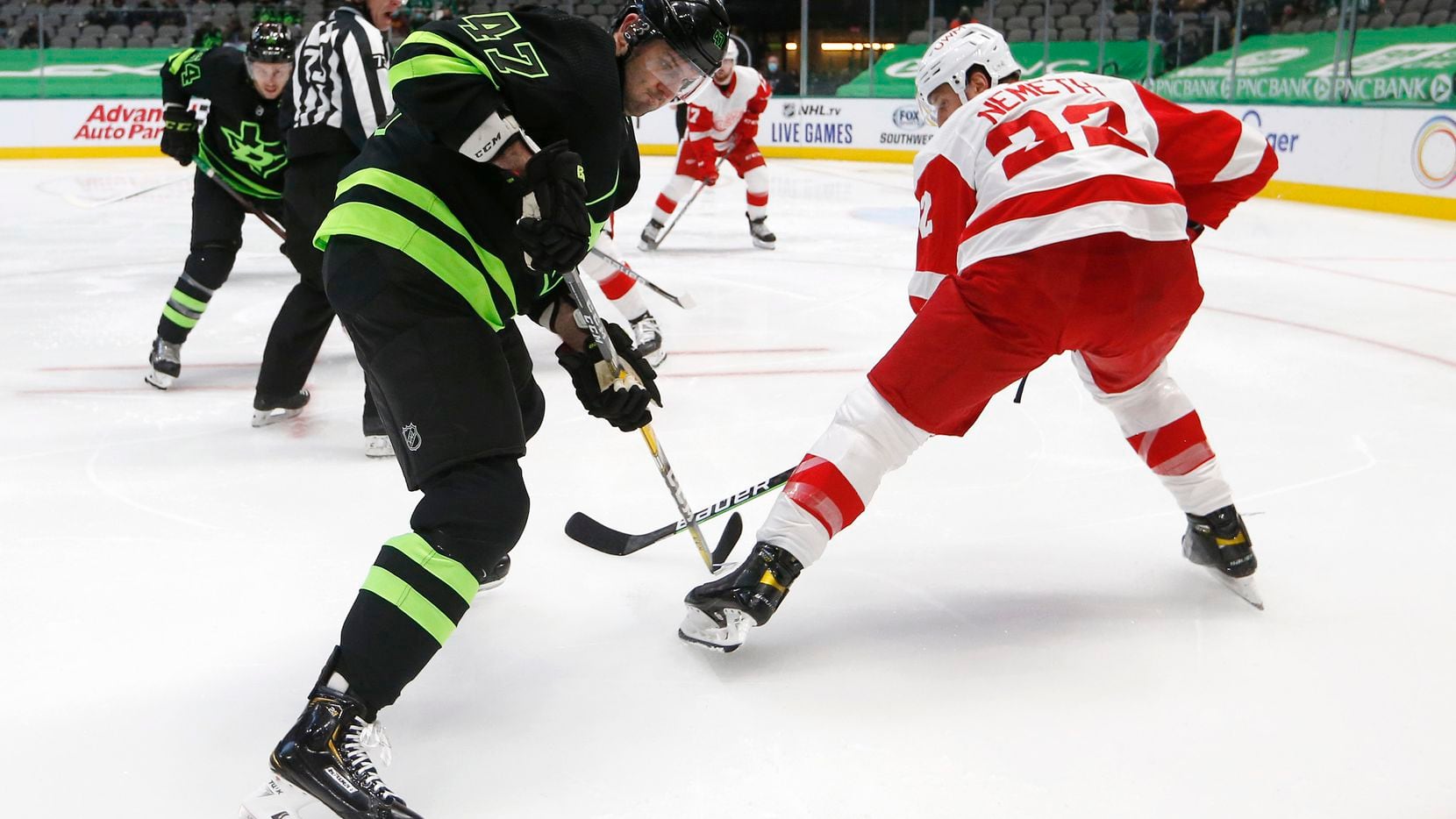 Stars right wing Alexander Radulov (47) rushes toward the puck as Red Wings defenseman Patrik Nemeth (22) defends during the first period of play at American Airlines Center on Thursday, Jan. 28, 2021,in Dallas.