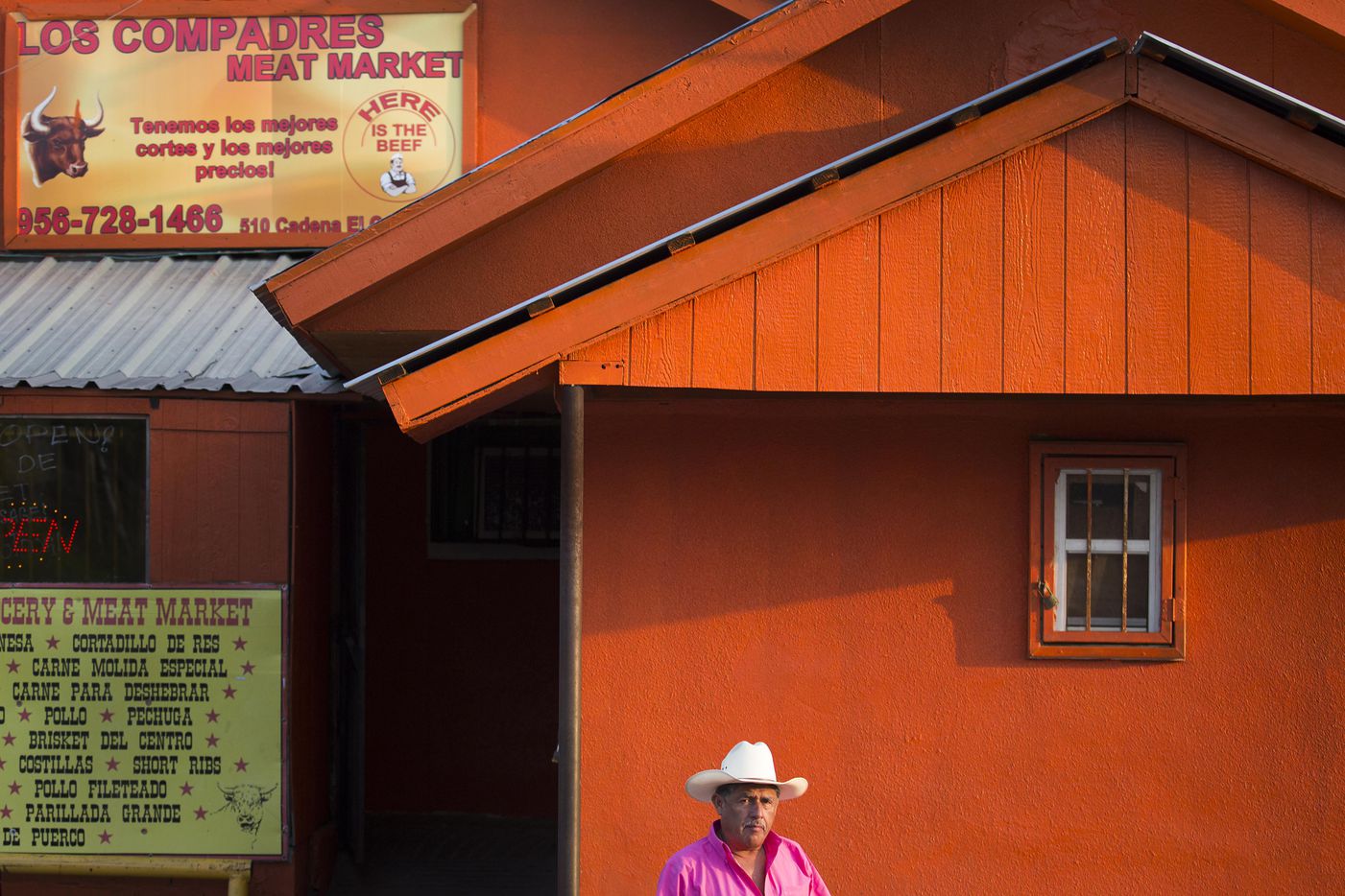 A man walks out of Los Compadres Meat Market on May 10, 2017, in El Cenizo, Texas.