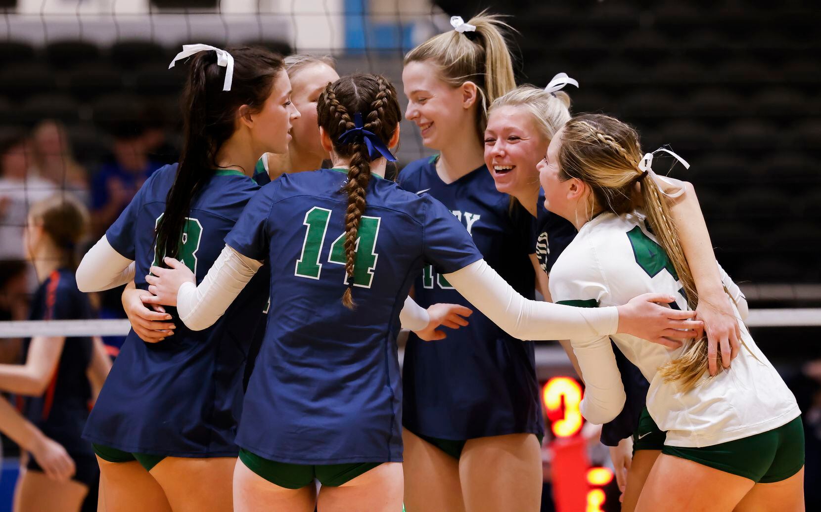 Frisco Reedy celebrate gaining a point against Frisco Wakeland during the second set of a...