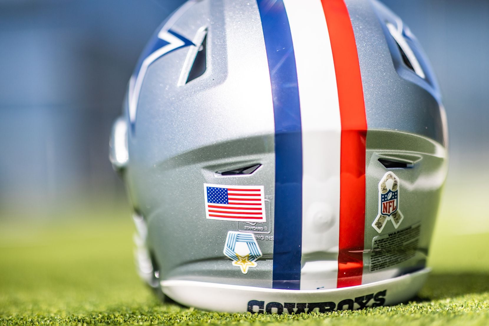 A look at the decals on the back of the Dallas Cowboys' red stripe helmet for Sunday's game.