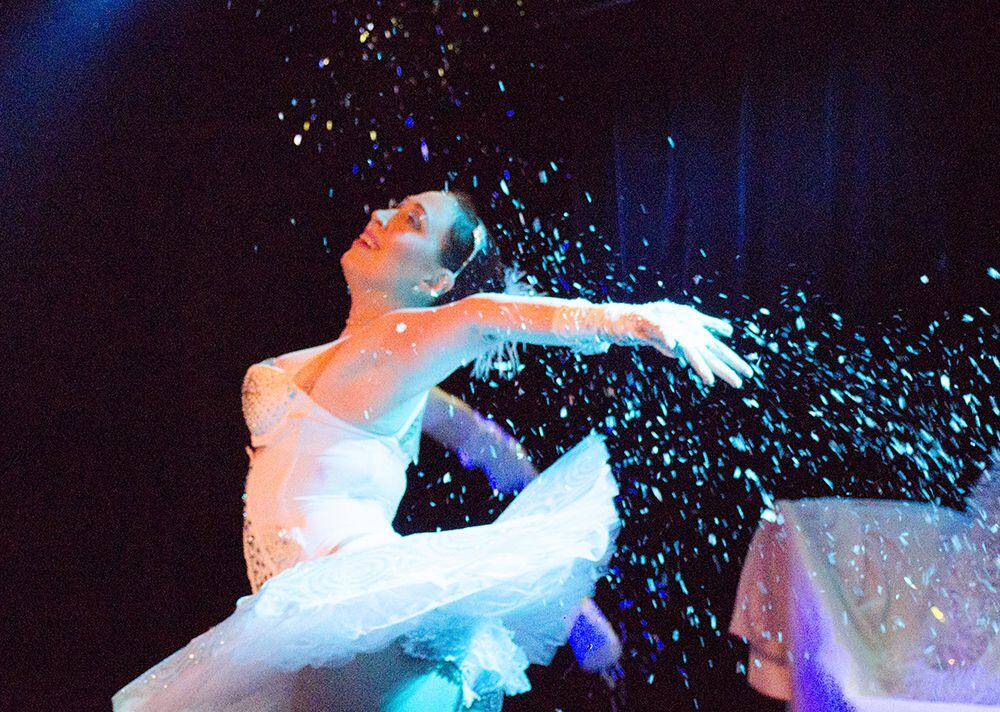 Snow Queen Ella Ardour dances in glitter at the 5th annual Nearly Naked Nutcracker.