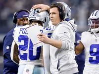 Dallas Cowboys offensive coordinator Kellen Moore congratulates running back Tony Pollard...